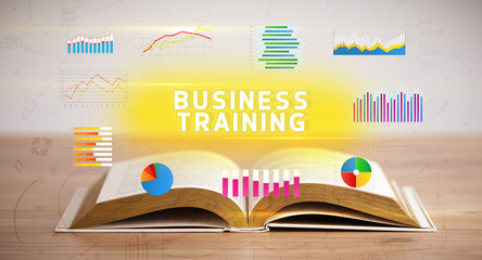 Open book with BUSINESS TRAINING inscription, new business concept