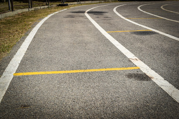 black tarmac asphalt of running track, athletic sport background