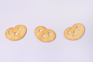 Sweet Small Pretzel on a Blue Background Top View Horizontal