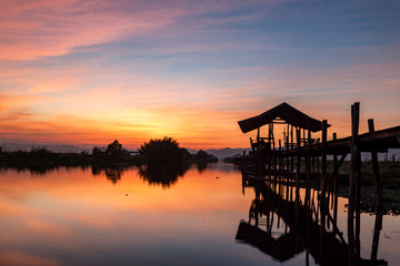 Fototapeta na wymiar Sunset at the Maing Thouk Wooden Bridge
