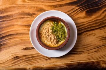milk dessert with nuts  (sütlaç) in turkey
