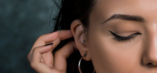 close-up photo of female eye with eyeliner makeup - obrazy, fototapety, plakaty