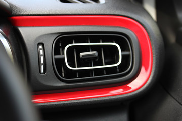 Red accent on modern vehicle dashboard