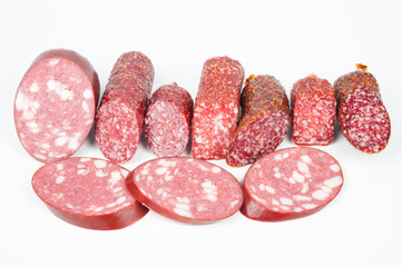 Smoked sausage in assortment on a white background