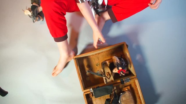 A child moves a pirate ship closer to himself. Coins a wallet. The concept of independent play of the child.