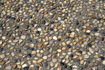 Close up of Park sidewalk paved with pebbles