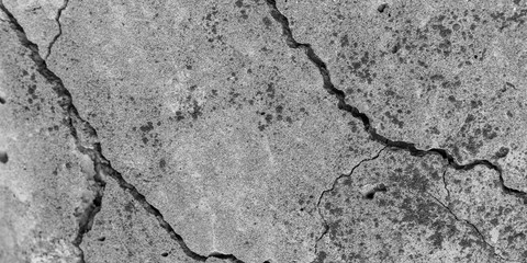 Abstract cement background. Cracked concrete texture closeup.