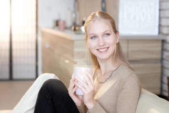 Happy woman with tea