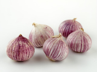 Fresh garlic on market table closeup photo