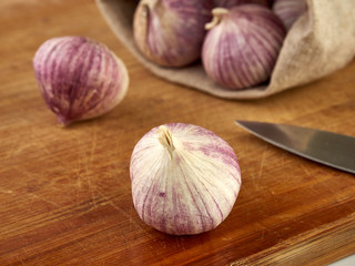 Fresh garlic on market table closeup photo