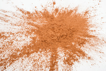 Pile cocoa powder on white background