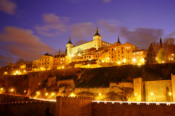 Fototapeta na wymiar Toledo in Spain at night. Famous UNESCO World Heritage Site. The historic city in beautiful illumination after sunset.
