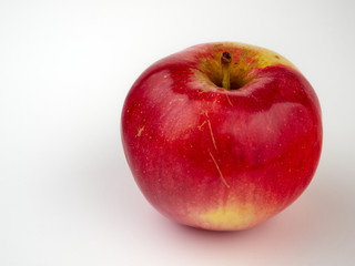 Bright beautiful red apples on a colored background