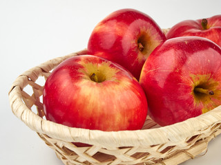 Bright beautiful red apples on a colored background