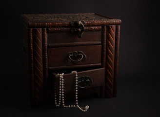 wooden casket with jewelry