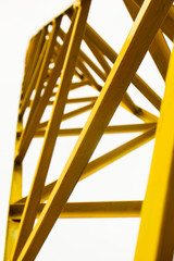 abstract yellow steel construction on white background