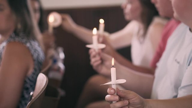 Lighting candles during church service