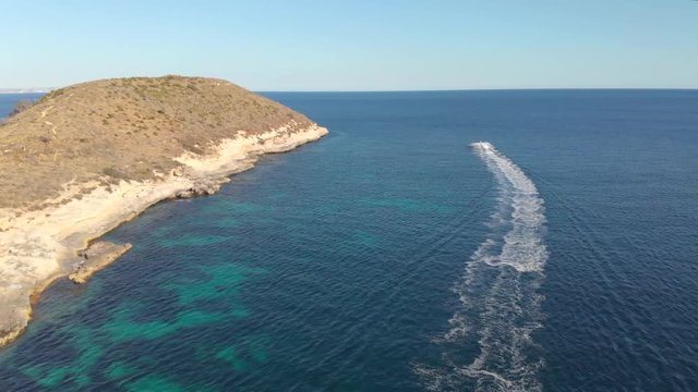 Jetskis cruising away