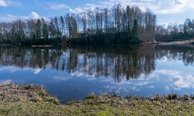 the view of the calm lake, the blue sky