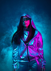 Neon portrait of a girl of Asian appearance, dressed in futuristic clothes and glasses. Neon blue and pink light. Virtual reality glasses and binary code in them.