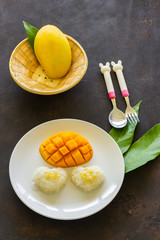 mango​ slice​ and​ sticky rice on white​ plate