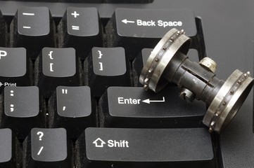 A roller perf sprocket on the enter key pad is concept to the crush.