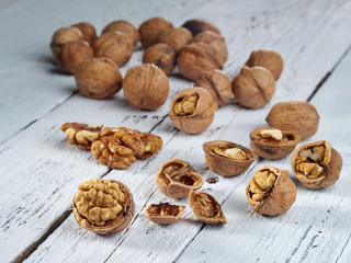Walnuts lie on a light colored background