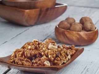 Walnuts lie on a light colored background
