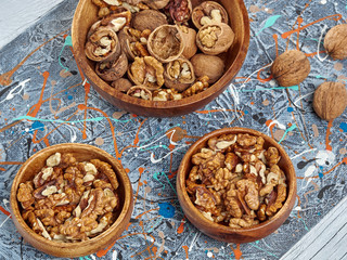 Walnuts lie on a light colored background