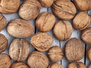 Walnuts lie on a light colored background
