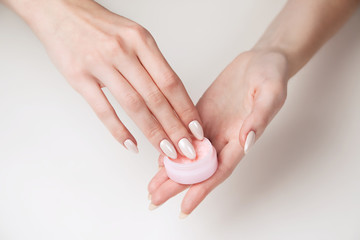 Girl takes a portion of cream from a can of cream