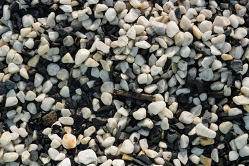 Background image of small black and white round pebbles