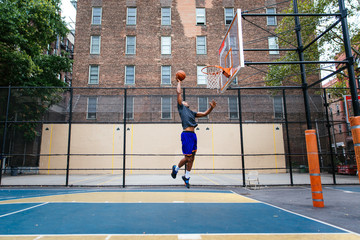Basketball player training on a court in New york city © oneinchpunch