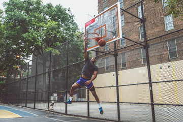 Basketball player training on a court in New york city © oneinchpunch