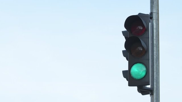 Traffic light changing from red to green