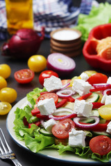 A plate full of bright fresh vegetable salad	