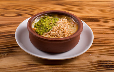 milk dessert with nuts  (sütlaç) in turkey