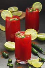Jalapeno tomato margarita cocktail with lime	