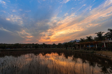 Fototapeta premium The lake under the setting sun reflects the sunset