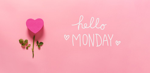 Hello Monday message with heart flower top view flat lay