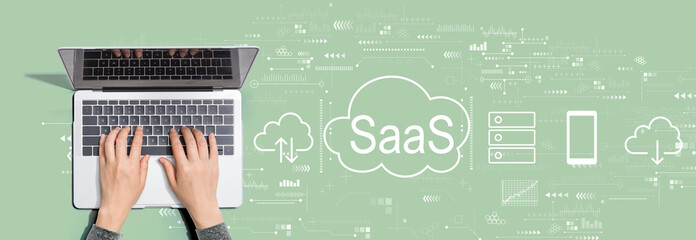 SaaS - software as a service concept with person using a laptop computer