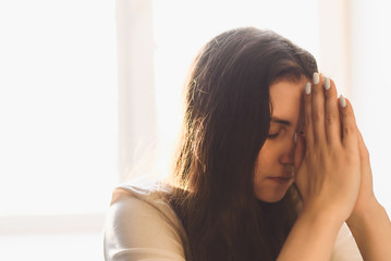 Fototapeta premium Woman hands praying to god. Woman Pray for god blessing to wishing have a better life. begging for forgiveness and believe in goodness. Christian life crisis prayer to god