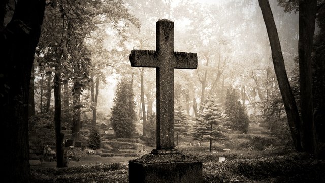 cross in fog at the cemetary