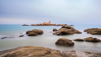 Small in the middle of the sea,The reef is covered by the sea.