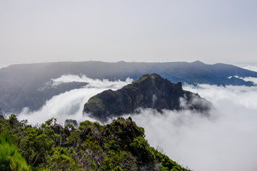 Fototapeta na wymiar Madeira mountain landscape spectacular view clouds roller wave horizon blue sky outdoor traveling concept encumeada pass