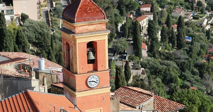 Aerial View Of A Typical Church Bell Tower With Clock In The South Of France, Old Village Of Roquebrune-Cap-Martin On The French Riviera In The Alpes-Maritimes In France - DCi 4K Resolution