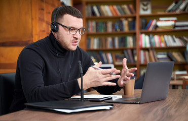 man filming video blog on camera with tripod for online followers. In social media, Influencer, new...