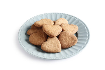 Cookies hearts on a plate isolated on white background