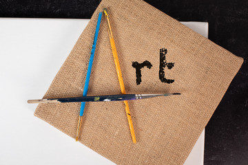 Word art creatively placed paint brushes burlap canvas crafty creative arts sign