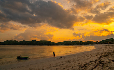 colorful sunset with many clouds at the Tanjung Aan beach in Lombok Indonesia
